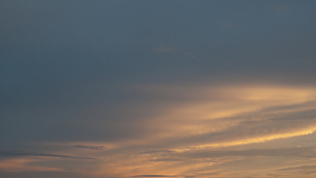 Blue-gray background, the photo shows the evening sky in blue and gray pastel tones
