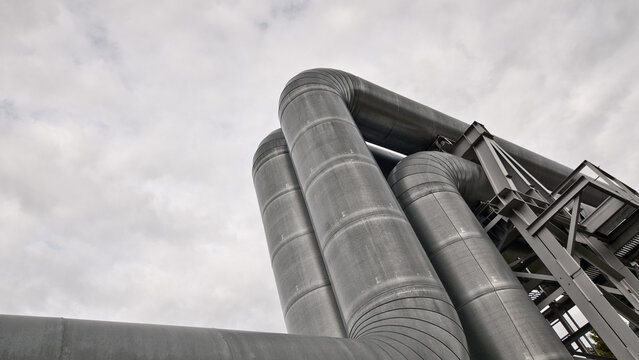 close-up of a pipeline against a gray sky