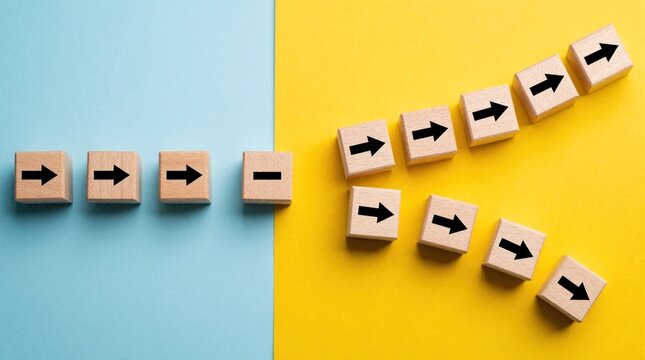 Wooden cubes with black arrows move from blue background to yellow background. Single path splits into two different directions. Concept of business change, growth, choice, decision making, strategic