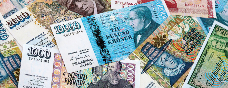 Icelandic krona money banknotes pile on table. Iceland bills of ISK currency. Concept of economy