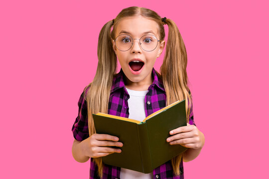 Photo of small lady reading adventure story unexpected final ending wear specs checkered shirt isolated yellow background