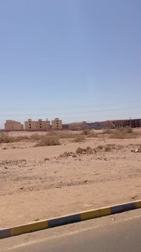 Vast desert landscape with distant mountains under clear blue sky Egypt. Hurghada