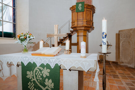 Wide view of church altar with wooden pulpit