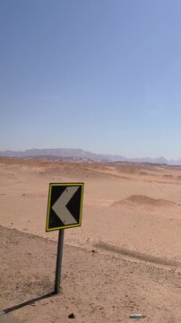 Vast desert landscape with distant mountains under clear blue sky Egypt. Hurghada