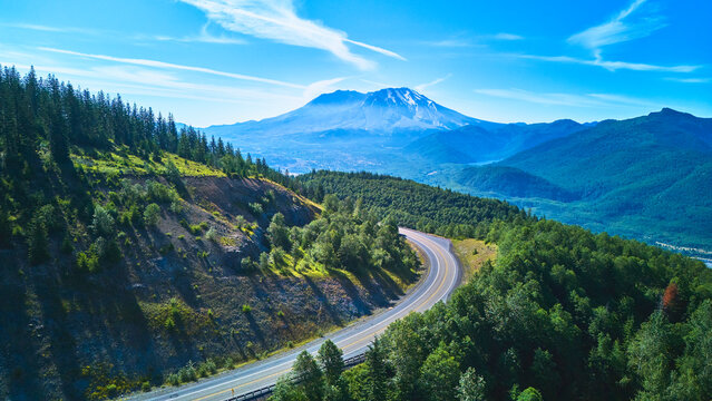 Aerial Winding Road Through Forest and Scenic Mt St Helens in Washington State