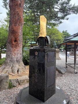 Golden samurai helmet monument at Oyama Shrine in Kanazawa, Japan