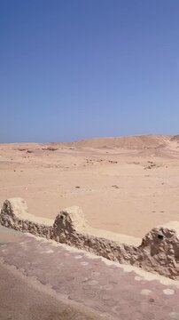 Expansive desert landscape under clear blue sky: stunning vast sandy terrain Egypt. Hurghada