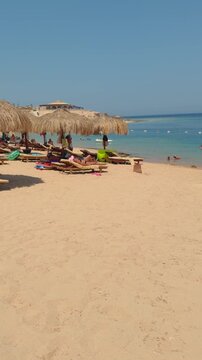 Blissful beach escape with tiki huts and turquoise sea on a sunny day Egypt. Hurghada