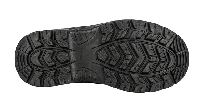 Detailed view of a black rubber shoe sole with a rugged tread pattern for outdoor traction