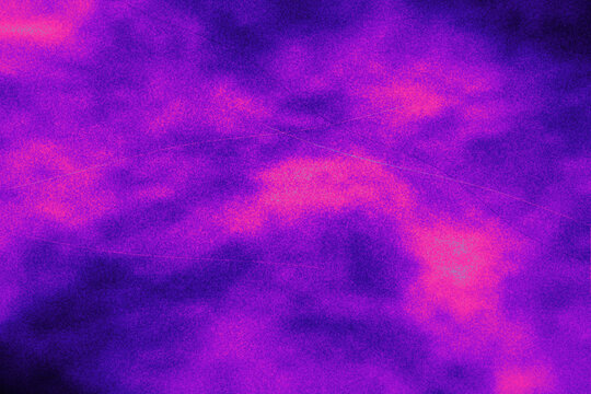 Abstract vibrant purple and pink light dust effect with subtle grunge texture and faint scratches for energetic overlay or creative background design.