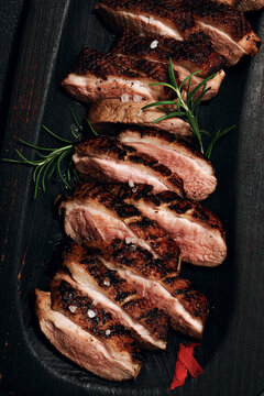 Fried duck breast with fresh orange and ginger, ready to eat food. Domestic cuisine, poultry meat