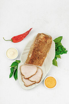High-protein roasted pork loin served with tasty sauces, styled for food photography