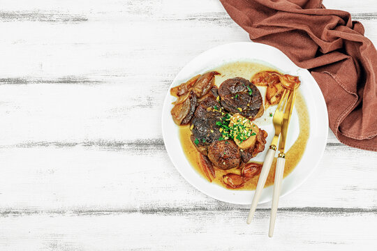 Ossobuco beef meat with spices and fresh herbs. Veal shank steak, traditional Italian ingredient