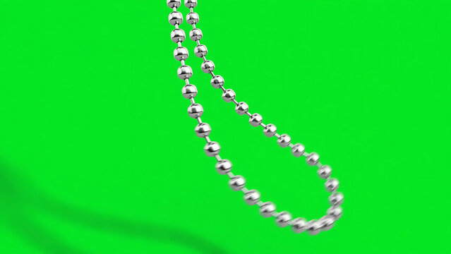 Shiny silver metal ball chain swinging slowly back and forth against a bright chroma key green background