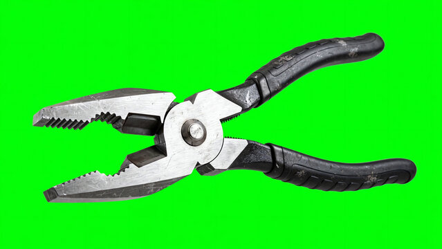 Heavy duty steel combination pliers rotating and opening jaws against a bright green screen background for chroma keying
