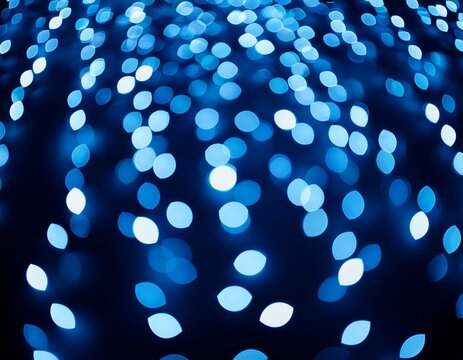 abstract blue bokeh lights on dark background