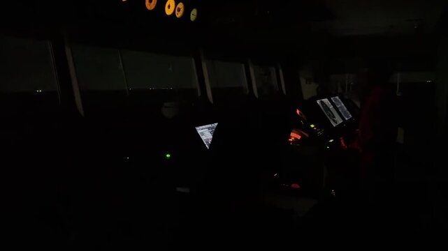  navigation bridge of the merchant vessel at the night.