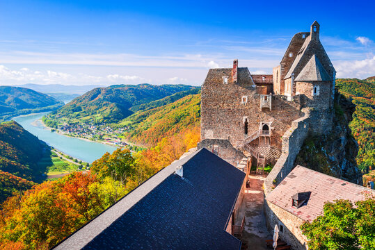 Beautiful landscape with Aggstein castle ruin and Danube River at sunset in Wachau valley Austria.