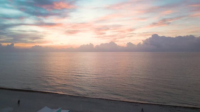 Pastel dawn skies over a quiet miami beach lifeguard tower