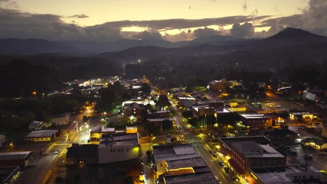Franklin, North Carolina at sundown. Popular tourist town surrounded by dark Appalachian mountain hills.