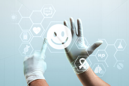 Gloved hands touching a smiling face icon on a futuristic health interface
