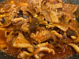 Spicy stir-fried baby octopus in red chili sauce, Korean style seafood dish © 유진 김