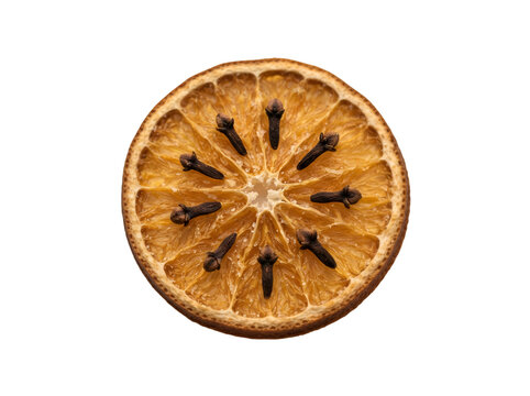 Dried orange slice displaying embedded cloves, exhibiting a warm, rustic aesthetic, perfect for culinary concept and seasonal decoration imagery, isolated on transparent background