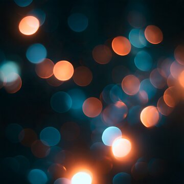 abstract bokeh light reflections with glowing warm orange particles and cinematic atmosphere on dark background