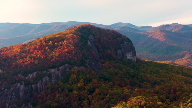 Looking Glass Rock is massive granite mountain formation near Blue Ridge Parkway, Asheville and Brevard. Pisgah National Forest in fall season.