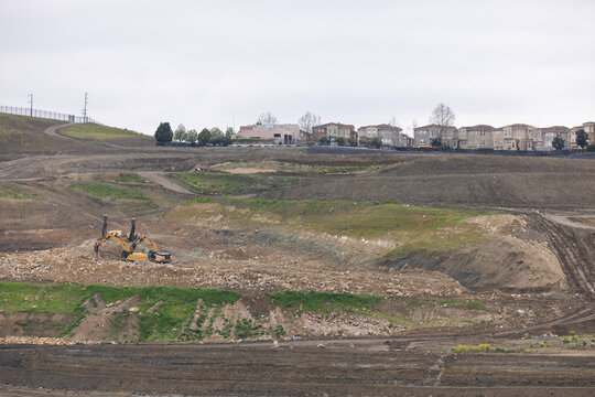 Excavators level a hillside in the Communications Hill neighborhood to build more housing and development in San Jose, California, USA.