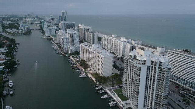 Aerial cruise along a misty miami beach intracoastal skyline