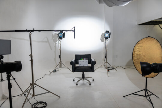Studio, interview, movie, camera, lights film production studio with lights and chair