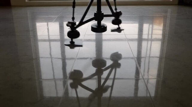Pendulum reflection moving on a floor