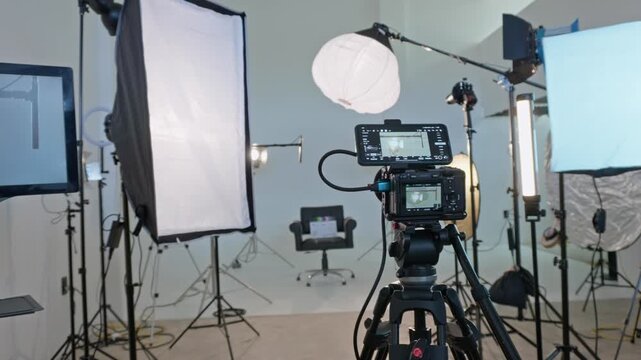 Professional camera on tripod in a film studio setup