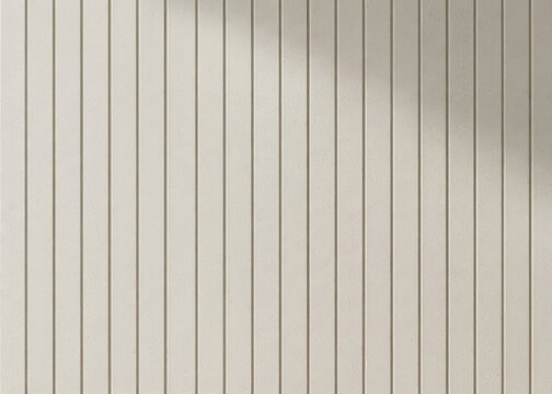 A vertical wall is covered with vertical wooden slats. The slats are light beige in color and have a subtle texture.
