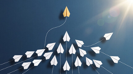Fototapeta premium Unique Gold Paper Plane Leading White Paper Planes on Blue Background, Concept for Leadership, Business Innovation, Success, Management, and Strategic Direction towards New Goals and Solutions
