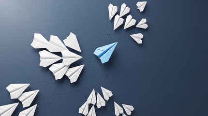 Fototapeta premium Conceptual Business Illustration of a Single Blue Paper Plane Flying in a Different Direction from a Group of White Planes Representing Leadership, Innovation, Individuality, and New Strategy
