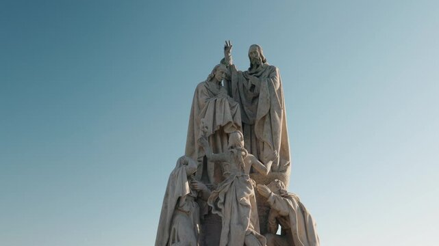 Upward View of Stone Statue Group on Charles Bridge in Prague
