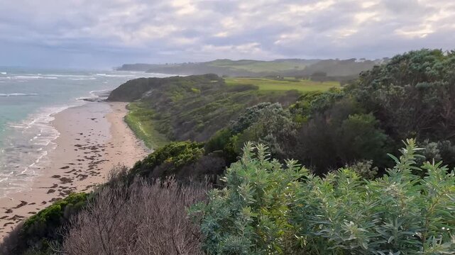 Scenic Elevated View of Rugged Coastline and Rolling Ocean Waves