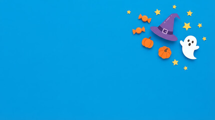 Obraz premium Happy Halloween simple flat design with ghost, witch hat, pumpkins, candy, and stars on blue