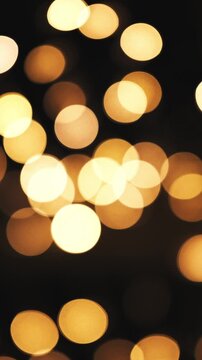 Glowing Golden Garland Creates An Abstract And Blurred Christmas Bokeh Background
