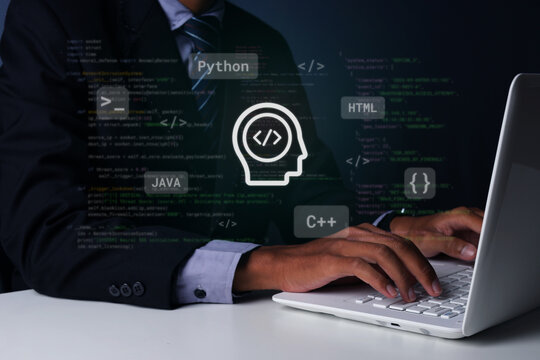 Business Person Typing on Laptop with Holographic Coding Icons