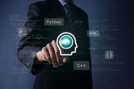 Businessman Pointing at Digital Head Icon Surrounding Programming Languages on Dark Background