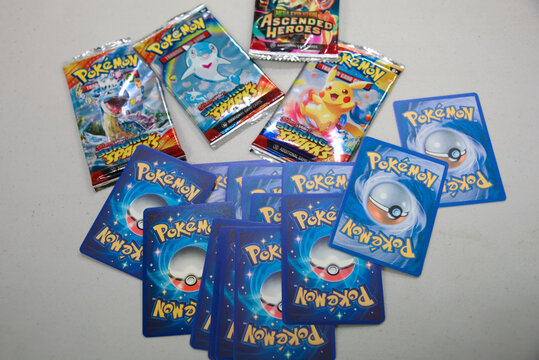 Semaphore, South Australia - July 22 2026: Collection of unopened fake booster packs and individual cards, highlighting the prevalence of imitation products in the collectible market