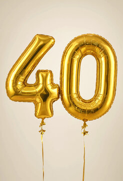 Golden foil number forty balloons celebrating special milestone occasion