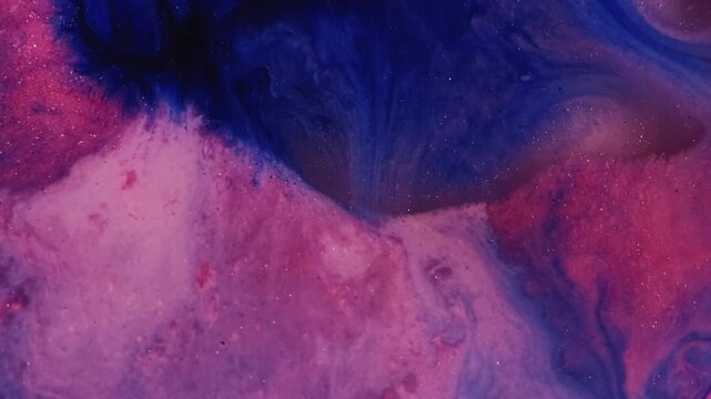 Shimmer ink. Acrylic mix. Defocused pink blue purple colorful water oil bubbles glitter pigment spill on abstract bright art background.