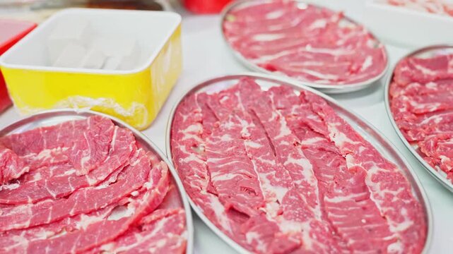 Close-up of raw beef slices and tofu for Chinese hot pot