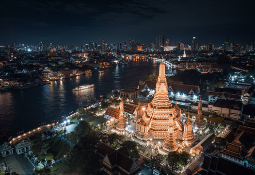 Aerial night view of Wat Arun on the Chao Phraya River, Bangkok, Thailand