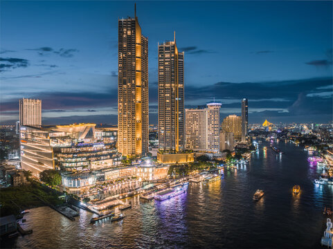 Aerial night view of the skyline along the Chao Phraya River, Bangkok, Thailand