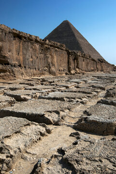 One of the rock quarries on the Giza Plateau where stone was cut for the building of the pyramids at Cairo in Egypt. In the background stands the Pyramid of Khufu.
